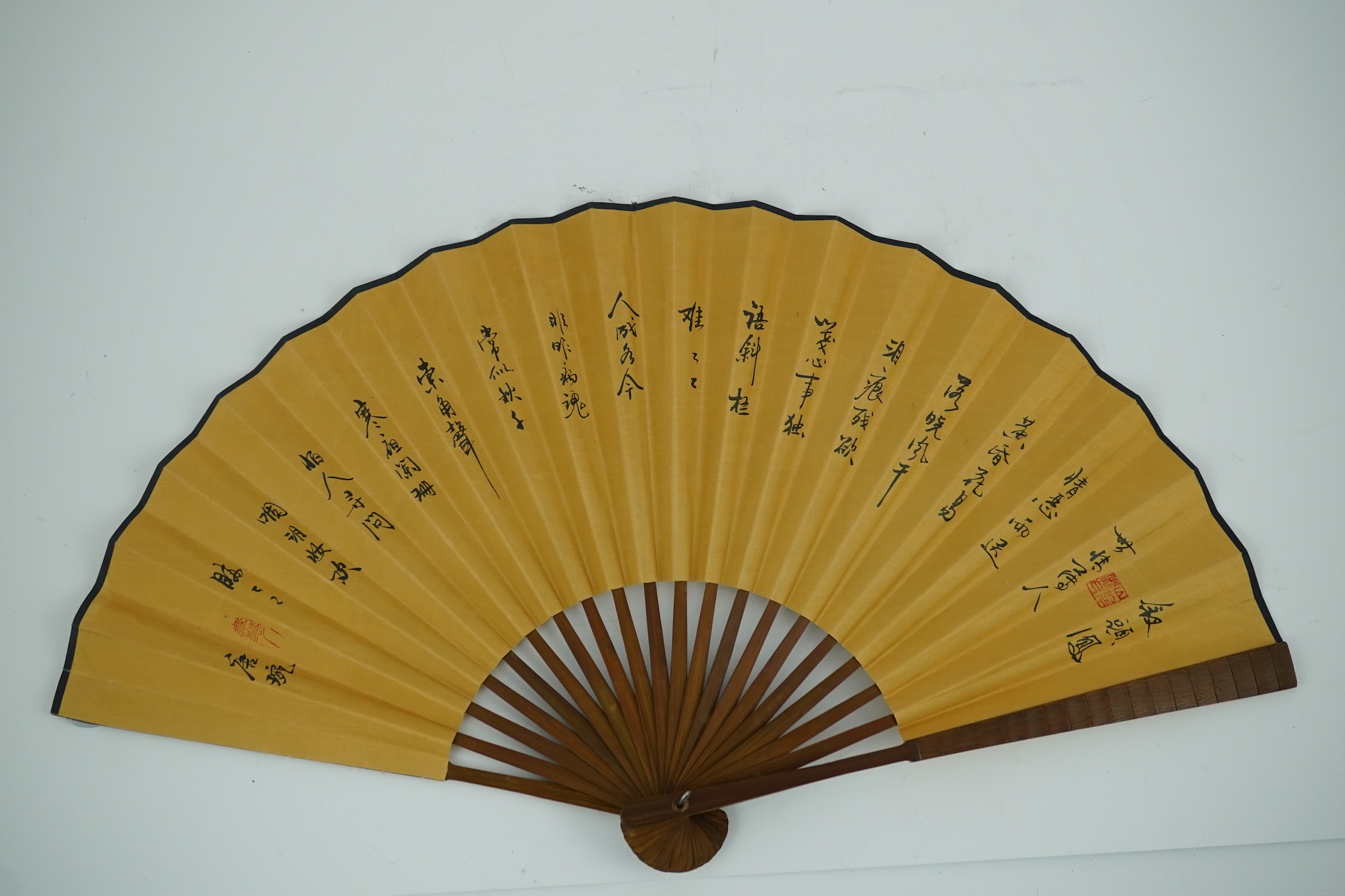 A fine Chinese sandalwood brise fan with finely carved sticks and guards, together with a mid 20th century silk calligraphic poetry LuYou fan, brise fan 38cm wide. Condition - minute damage to carving on one stick, sanda